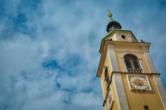 Looking up the Bell Tower of St-Nicholas Church in Ljubljana, Slovenia